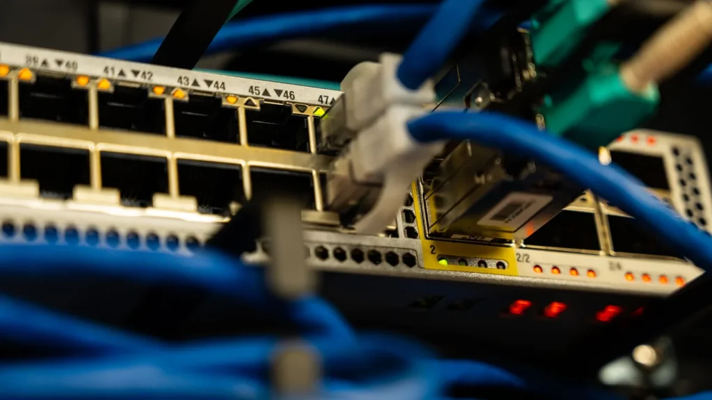 Network cables plugged into a switch, the connection a SIP trunk runs over