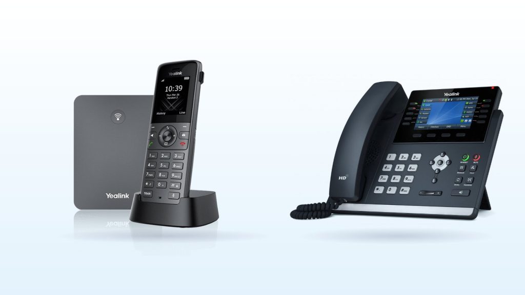 Yealink W73P cordless DECT phone and base beside a Yealink T46U IP desk phone